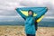 Panoramic view of Babia Gora Mountains with woman with Ukrainian flag celebrates victory on top of a mountain.