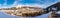 Panoramic view of balloons and snow-capped mountains over Schladming, Austria