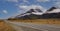 Panoramic view of Banner of traveling on the road with mountain range near Aoraki Mount Cook and the road leading to Mount Cook