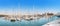 Panoramic view of the Barcelona port with rows of yachts