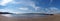 Panoramic view of the beach at arnside with the leven railway viaduct and river in the south lakes area of cumbria