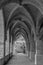 Panoramic view of a beautiful arcade with vaulted ceilings in a reconstructed monastery in XÃ tiva, Spain. Black and white image