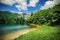 Panoramic view of beautiful mountain range with crystal clear lake