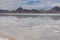 Panoramic view of beautiful mountains reflecting in lake of Bonneville Salt Flats, Wendover, Western Utah, USA, America. Looking