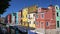 Panoramic view of beautiful multicolored houses and canal in Burano, Venice