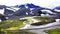 Panoramic view of beautiful snow mountain and the stream of melting snow