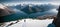 Panoramic view of beautiful snowy peak mountain range during sunset light