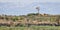 Panoramic view on a beautiful wild west landscape with stone walls, cottage and a broken windmill in Dingli, Malta on a sunny,