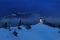 Panoramic view of beautiful winter wonderland mountain scenery in the Alps with pilgrimage church of Jamnik and famous Julian Alps