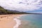 Panoramic view at Big Beach. People enjoy sunny day at a long sand beach of Wailea-Makena