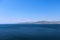 Panoramic view of Black sea with blue air. Black Sea, Crimea. Mountain relief disappearing on the horizon in a foggy