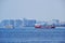 Panoramic view of the Bosphorus. View of the ships sailing along the strait and high-rise buildings on the shore.