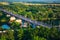 Panoramic view of bridge over river Klyazma in Vladimir city with railroad and green trees