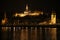 Panoramic view of Budapest by night with niight ship on the Danube