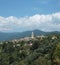 Panoramic view of Bussana Vecchia in a green hilly landscape