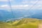 Panoramic view from cableway cabin to Carpatian mountains, walking paths and towns at the background, Bucegi natural park near Si