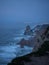 Panoramic view of Cabo da Roca lighthouse steep rocky cliffs beach rough coast atlantic ocean Sintra Natural Park