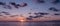 Panoramic view of the calm sunrise over the ocean