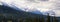 Panoramic view of the Canadian Rockies mountain peaks taken from