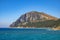 Panoramic view of Capo Figari cape cliffs and rocks with Monte Ruju mount at the Tyrrhenian Sea coast in Golfo Aranci, Sardinia,