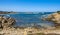 Panoramic view of Capo Figari cape rocks and seashore of Spiaggia di Cala Spada beach at the Tyrrhenian Sea coast in Golfo Aranci