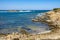 Panoramic view of Capo Figari cape rocks and seashore of Spiaggia di Cala Spada beach at the Tyrrhenian Sea coast in Golfo Aranci