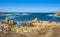 Panoramic view of Capo Figari cape rocks and seashore of Spiaggia di Cala Spada beach at the Tyrrhenian Sea coast in Golfo Aranci