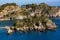 Panoramic view of Capo Taormina cape with Isola Bella island on Ionian sea shore in Messina region of Sicily in Italy