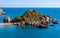Panoramic view of Capo Taormina cape with Isola Bella island on Ionian sea shore in Messina region of Sicily in Italy
