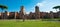 Panoramic view of Caracalla springs ruins from grounds with turists at Rome