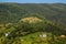 Panoramic view of Carpathian mountains. Green forest and houses in mountains. Green tourism.