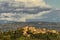 Panoramic view of Certaldo alto lit by the late afternoon sun, against a beautiful sky, Tuscany, Italy