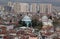 A panoramic view of the city of Bursa with many mosques and a Green Tomb in the center of the photo