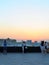 Panoramic view of the city from the observation deck on the roof of Kazan Mall and people admiring and photographing the sunset.