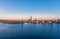 Panoramic view of the city of rostock - aerial view over the river warnow, skyline during sunrise in the morning