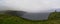 Panoramic view of the cliff of Moher with rain and fog