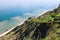 Panoramic view of cliffs of the rugged coastline with breakwaters protecting the beach of Fiorenzuola di Focara Pesaro, Marche