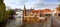 Panoramic view of the colorful buildings of Bruges Belgium reflecting on the canal water