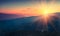 Panoramic view of colorful sunrise in mountains.