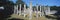 A panoramic view of columns surround grassy courtyard for ballgames at Chichen Itza, Mayan Ruins in the Yucatan Peninsula, Mexico