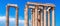 Panoramic view of Corinthian columns of Olympian Zeus temple on sky background, Athens, Greece