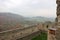 Panoramic view of courtyard of Hukvaldy medieval castle with colorful autumn forest and mountains on the background