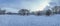 Panoramic view of covered in snow park with snowy tees and frosty lake in winter