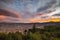 Panoramic view of Cusco town with glowing cloudscape and colorful sky at dusk. Cusco is among the most important travel destinatio