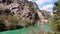 Panoramic view of dam habitat and river with emerald azure water. Beautiful artificial reservoir Green Canyon, forest