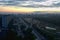 Panoramic view of the dawn sky and clouds above the city sleeping in the morning haze