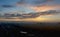 Panoramic view of the dawn sky and clouds above the city sleeping in the morning haze