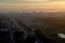 Panoramic view of the dawn sky and clouds above the city sleeping in the morning haze