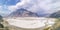 Panoramic view of desert with mountains and Indus river.