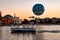 Panoramic view of Disney Springs and water taxi on colorful sunset background at Lake Buena Vista area 1